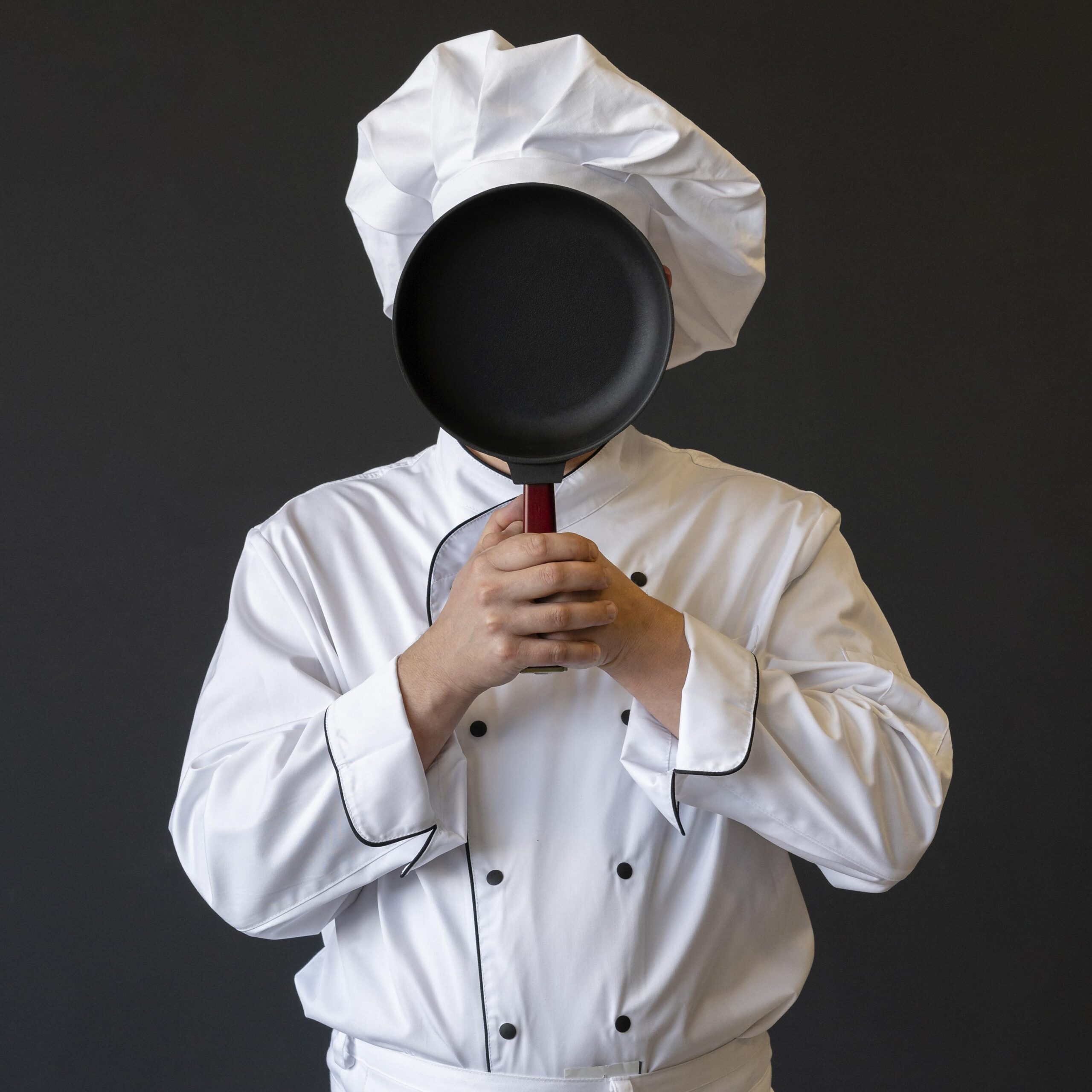 chef-covering-face-with-pan